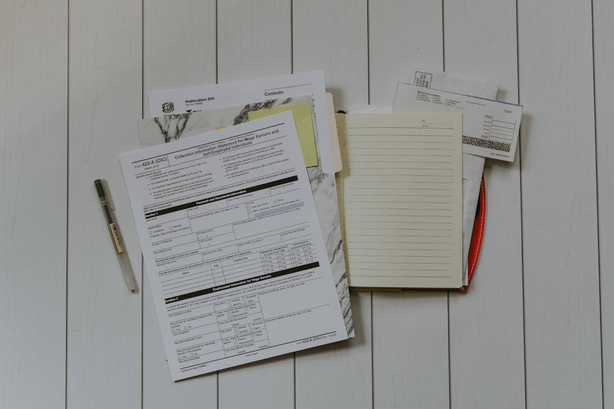Stack of tax documents and financial statements on a table