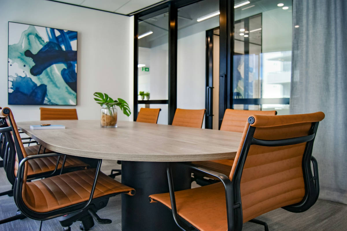 Office meeting room with chairs arranged around a large central table