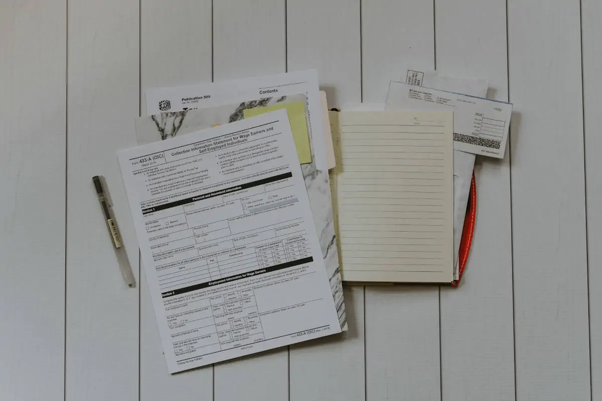 Stack of tax documents and financial statements on a table